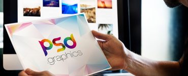 Man Holding Photo Mockup Free PSD