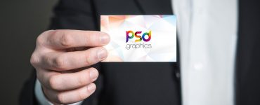 Free Business Card in Hand Mockup PSD