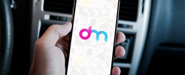 Free iPhone X in Hand Mockup PSD