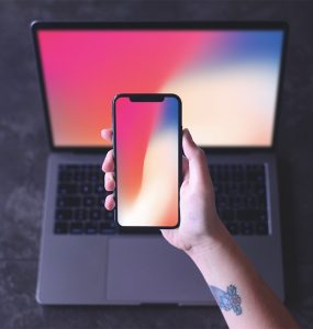 Free iPhone X in Hand Mockup PSD