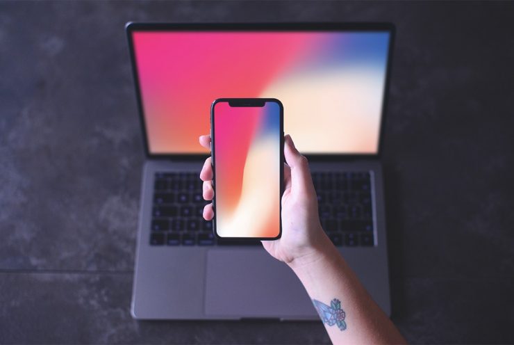 Free iPhone X in Hand Mockup PSD