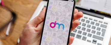 Hand Holding iPhone X Mockup PSD