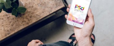 Female Holding iPhone in Hand Mockup