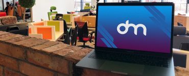 Free Macbook in Office Mockup