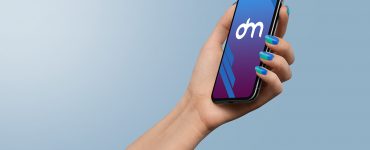 Holding iPhone Xs in Hand Mockup