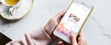 Woman Holding iPhone Mockup PSD