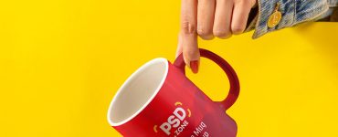 Holding Coffee Cup PSD Mockup