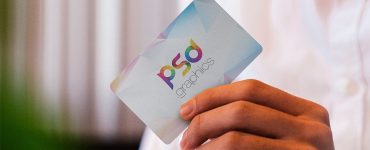 Man Holding Business Card in Hand Mockup