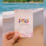 Holding Post Card in Hand Mockup