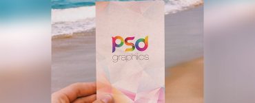 Holding Post Card in Hand Mockup