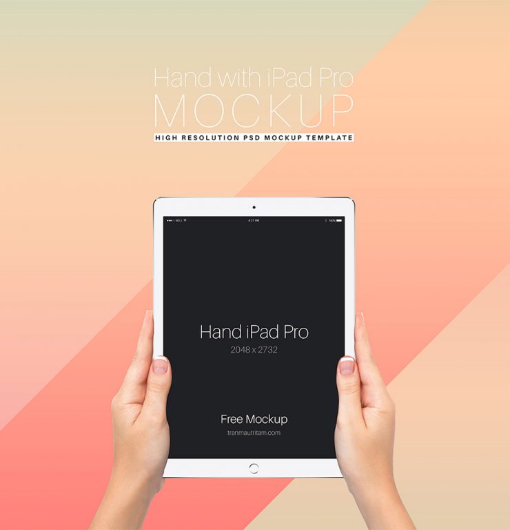 Hand Holding iPad Pro Free PSD Mockup Template
