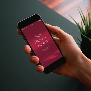 iPhone in Hand Mockup PSD