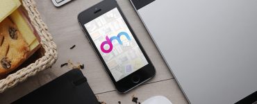 iPhone on Table Mockup Free PSD