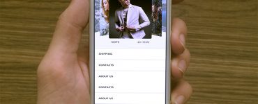 Hand Holding iPhone 5s White Mockup Free PSD