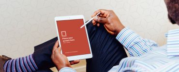 iPad Air in Hand Photorealistic mockup Free PSD